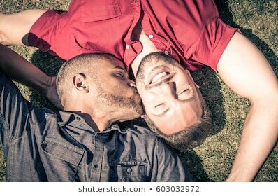 happy-gay-couple-lying-down-260nw-603032972-8797089